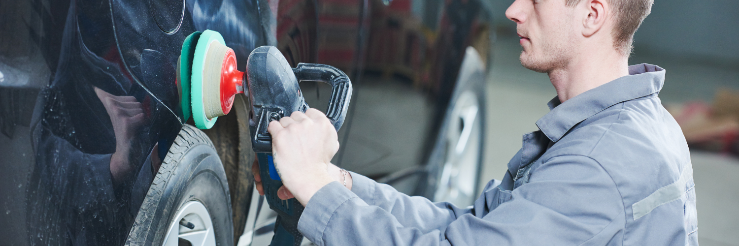 technician performing auto body repairs